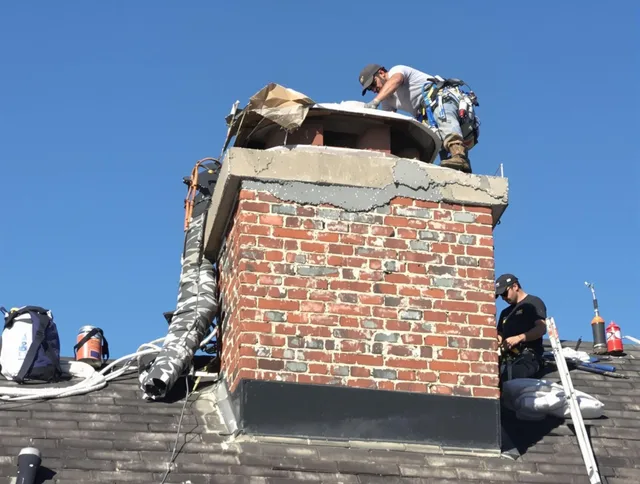 Windsor Chimney Sweep installing a custom chimney crown in Windsor, CO