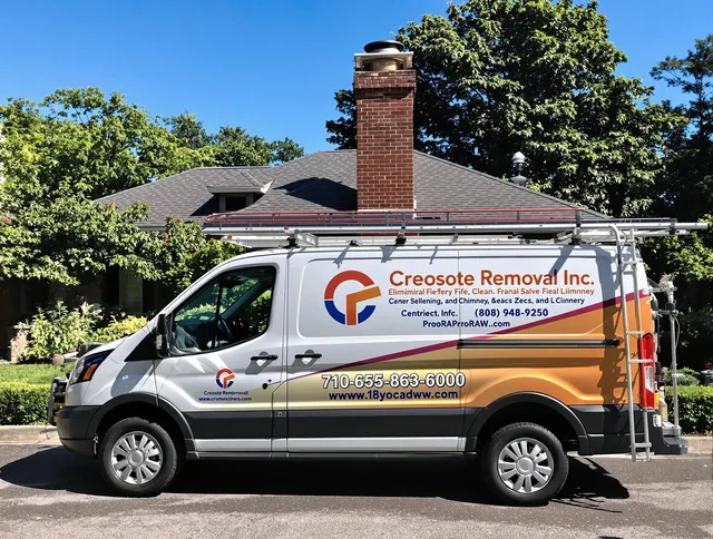 Windsor Chimney Sweep technician removing creosote safely in Windsor, CO