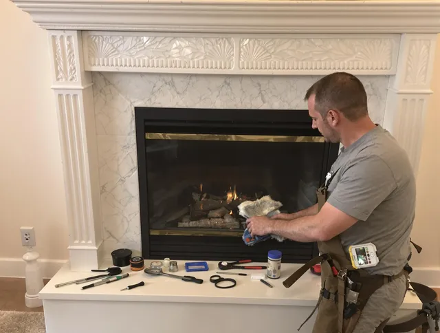 Windsor Chimney Sweep performing fireplace maintenance in Windsor, CO