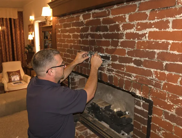 Windsor Chimney Sweep expert fixing a fireplace in Windsor, CO
